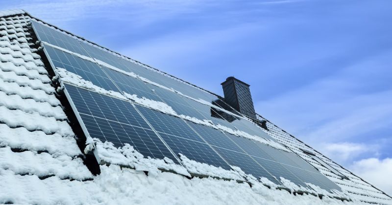 Snow and solar panels on the roof