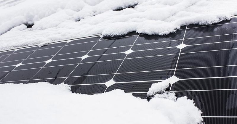 Snow and solar panels on the roof