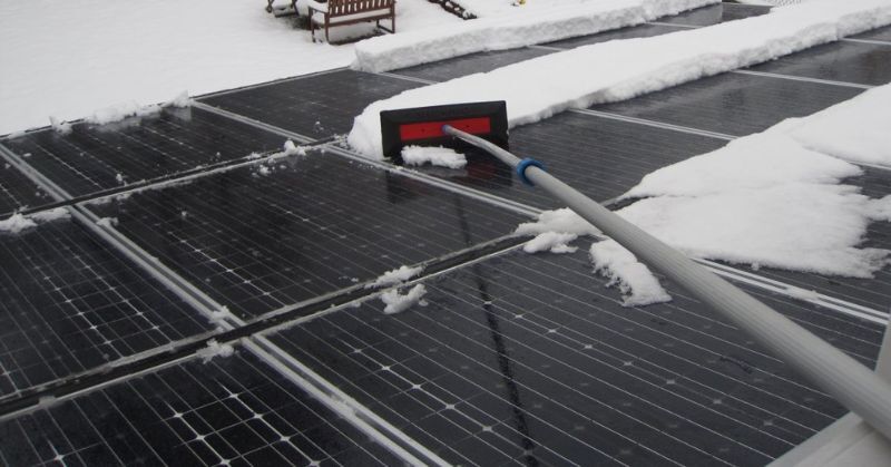 Cleaning solar panel on roof